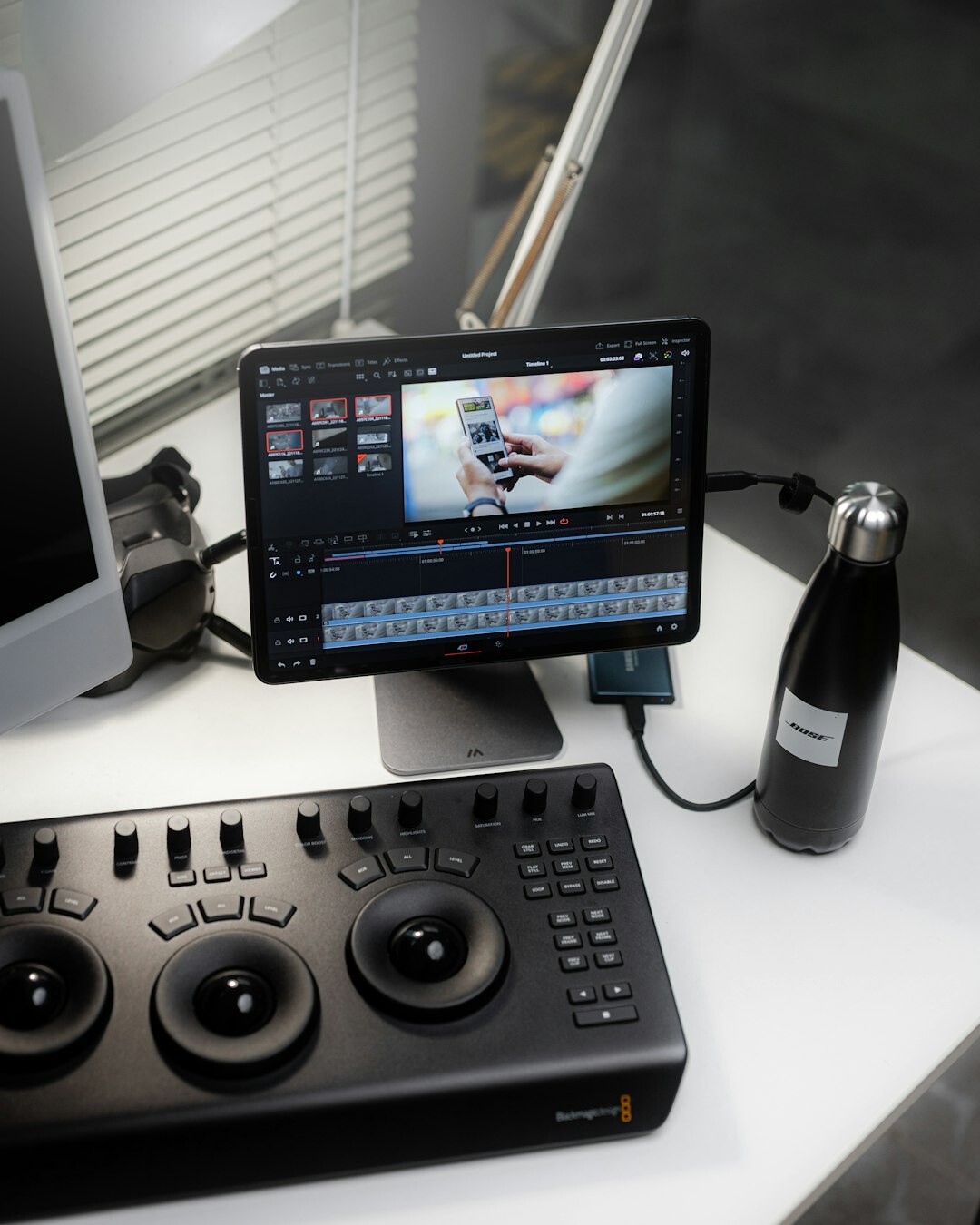 Video editor coordinating multiple live video feeds on a multi-screen desk